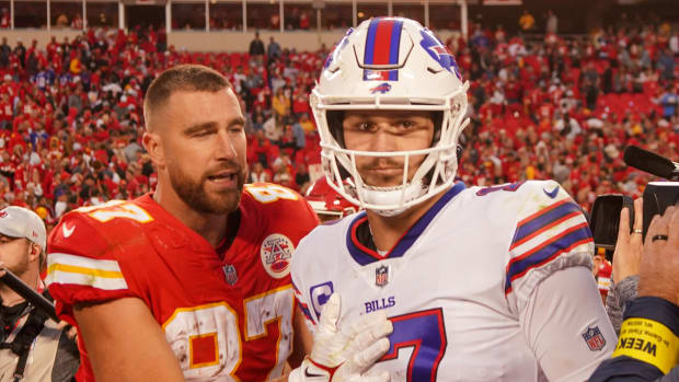 Kansas City Chiefs tight end Travis Kelce (87) talks with Buffalo Bills quarterback Josh Allen (17) after the game at GEHA Field at Arrowhead Stadium.